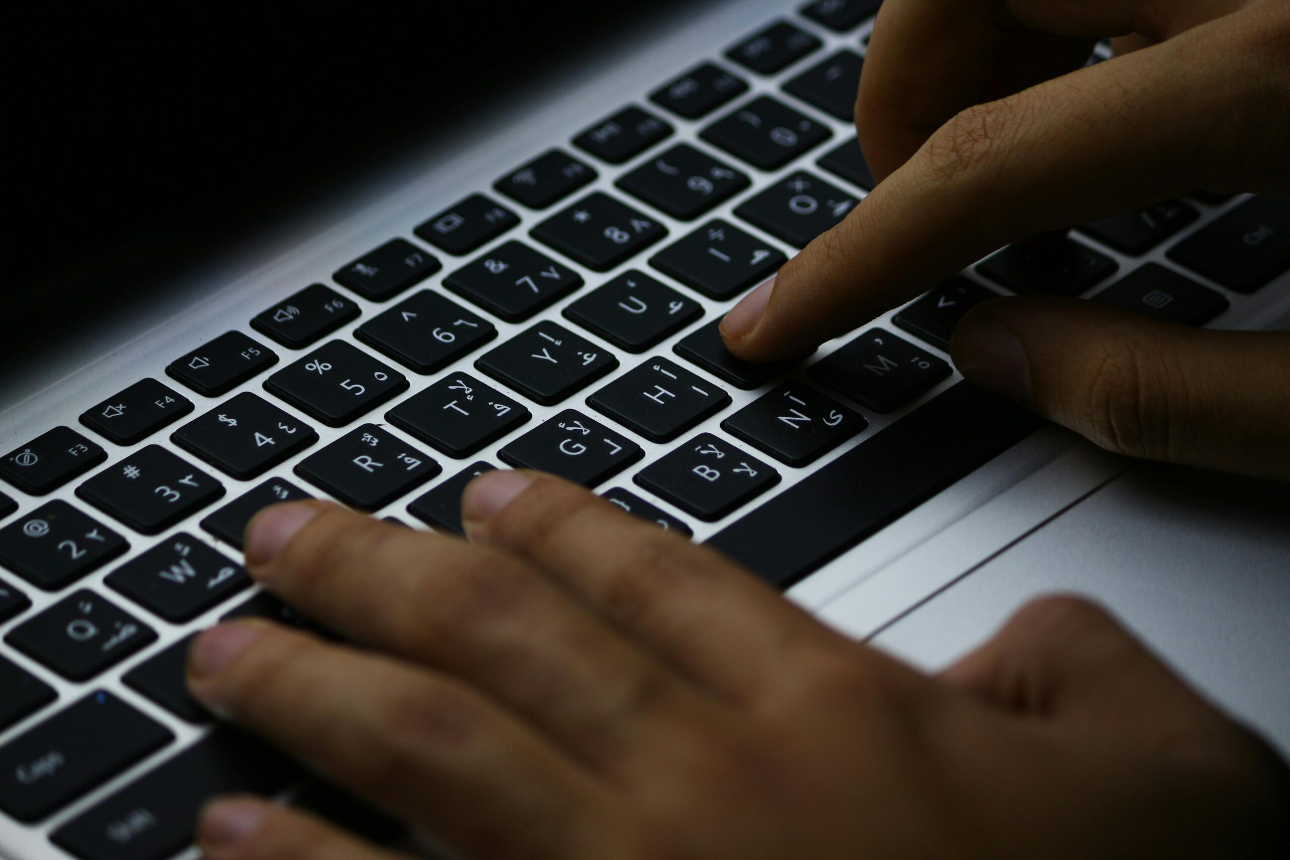 A Person coding on laptop